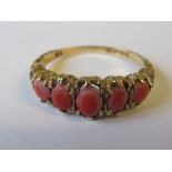 A Victorian style 9 carat gold five stone coral ring, set with graduated oval cabochons, finger size