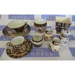 A collection of Imari pattern items, to include Royal Crown Derby loving mug, jugs, etc.