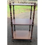 A mahogany three tier whatnot, of rectangular form, with turned columns, 16.5ins x 12.5ins, height