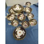 A 19th century English porcelain part tea service, comprising cake plate, six saucers, four
