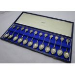 John Pinches London, a cased set of twelve silver zodiac spoons, sculpted by David Cornell, weight