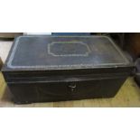 A leather covered trunk, with stud work decoration and metal edging, 34ins x 18ins x 15.5ins