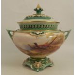 A Royal Worcester covered pot pourri vase, painted with pheasants in a landscape, signed W E Jarman,