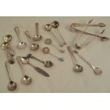 A collection of hallmarked silver and other condiment spoons, together with two pairs of sugar