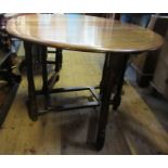 An oak gateleg table, with swing leg action, 59ins x 41ins, height 29.5ins