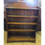 An oak set of floor standing shelves, with shaped top rail, height 49ins, width 36ins