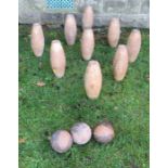 A set of wooden skittles, together with three balls