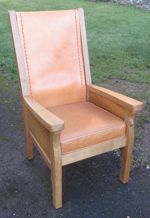 A Robert Mouseman Thompson oak and leather armchair, with leather back panel and cushion, height