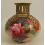 A Royal Worcester quarter lobed vase, decorated with roses and having a pierced neck, shape number