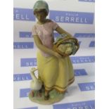 A Lladro model , Daily Chores, model number 2329, model of a girl, holding a basket with a goose,