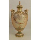 A Royal Worcester blush ivory vase, decorated with flowers to a blue/green ground, having mask