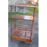A Victorian walnut canterbury whatnot, with pierced gallery to the top, af, barley twist supports,