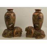 A pair of Japanese Satsuma vases, the baluster shaped vase decorated with figures and a dragon,