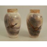 A pair of Royal Worcester vases, painted with pheasants and mallard in flight, signed Jas Stinton,