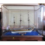 A wooden model, The Royal Yacht Caroline 1749, in a glass case, width of case 37ins