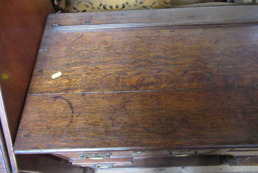 An Antique oak dresser base, fitted with three drawers over two small drawers, with arches to the - Image 3 of 3