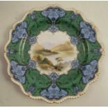 A Royal Worcester plate, decorated with a central panel of a landscape by H Davis in the style of