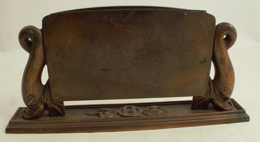 A 20th century Art Deco cast bronze desk top calendar, having dolphin supports, and marked with - Image 3 of 3