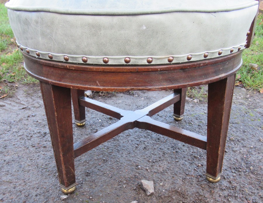 A mahogany framed and leatherette upholstered revolving office chair, raised on four legs united - Image 2 of 3