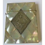 A mother of pearl diamond panel card case, having silver engraved and monogrammed panel on one side,