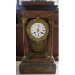 A 19th century continental mantel clock, of architectural form, with marquetry inlay and supported