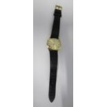 Patek Philippe, gentleman's gold wrist watch on a leather strap