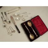 A collection of hallmarked silver flatware, to include sugar tongs, christening spoons, tea