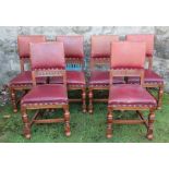 A set of six oak and upholstered dining chairs, with stuff over backs and seats, carved decoration