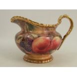 A Royal Worcester milk jug, decorated with fruit to a mossy background by P Love, dated 1954, height