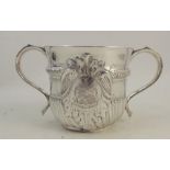 An 18th century Queen Anne Britannia standard silver two handled porringer, with gadrooned and