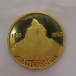 A gold commemorative coin, for Edward Whymper Matterhorn 14th July 1865, marked 900