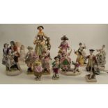 A group of 19th and 20th century porcelain figures, all of figures in period dress, some with mock