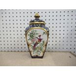 A Royal Worcester Grainger & Co pot pourri, decorated with panels of birds, to a scale blue