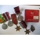 Sergeant F  J Waters, Royal Army Medical Corps World War 2, cap badge with five medals and old