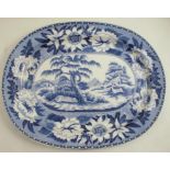 A 19th century English blue and white transfer printed meat plate, of oval form, decorated a leopard