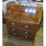 A 20th century bureau, with walnut veneered panels, fitted with three drawers under the pigeon