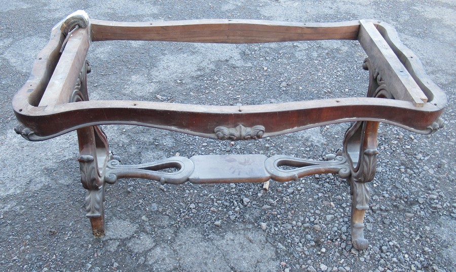 A 19th century mahogany table base, of shaped rectangular form, with raised carved decoration,