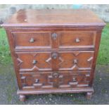 An Antique oak chest, of three long drawers, the drawers with moulded fronts, raised on bun feet,