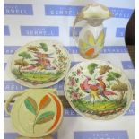 Two Myott pottery jugs, together with a pair of French pottery plates decorated with fabulous birds,