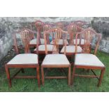 A set of eight mahogany dining chairs, with shaped top rail, pierced backs to a drop in seats,