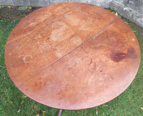 An Antique mahogany tripod table, with tilt top, raised on a turned column and three outswept - Image 2 of 3