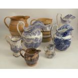 A collection of eight various 19th century blue and white and other jugs, to include a Masons