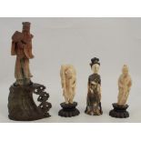 Two 19th century carved ivory figures, of Oriental men, on wooden bases, overall height 4ins,