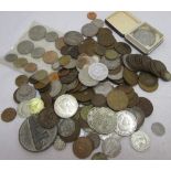 A collection of coinage, including crowns, medallions, pennies, with European and Northern