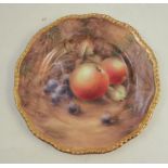 A Royal Worcester plate, decorated with fruit to a mossy background by P Love, dated 1953,