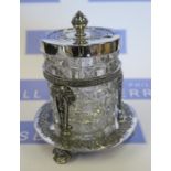 A Walker and Hall silver plated and glass preserve pot and stand, with engraved floral decoration,