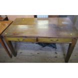 An oak desk, fitted with two frieze drawers, 29.5ins x 54ins x 30ins