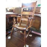 A Windsor armchair, with solid shaped seat