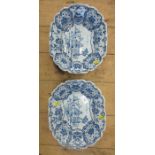 A pair of Delft dishes, decorated with a central panel of a figure and deer in a landscape, with