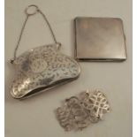 A hallmarked silver ladies purse, with engraved decoration, on a chain with suspension loop,